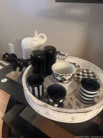 All items grouped on tray with elephants beside