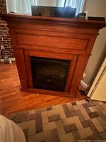 Front view of electric fireplace showing mantel and insert