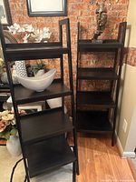 Front view of both ladder shelves showing five tiers each