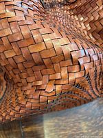 Close-up of woven leather construction on brown bag