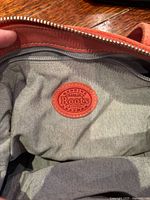 Interior view showing grey lining and leather Roots patch