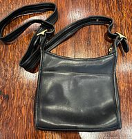 Black leather crossbody bag front view