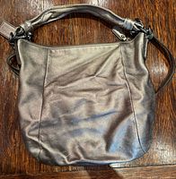 Front of metallic Coach shoulder bag