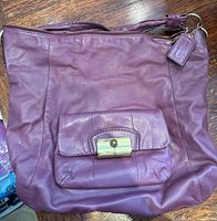 Purple leather Coach hobo bag front view