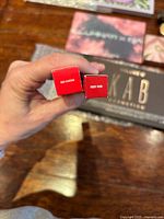 Top view of two red MAC boxes showing shade names