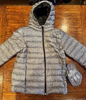 Jacket front view with stuff sack