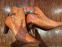 Chloe tan leather ankle boots showing side profile, heel, strap detail