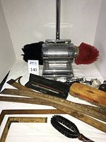 Group shot of Dremel polisher, rulers, squares, brushes, tape measure and scribe