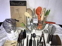Group shot showing all items including food processor, cookie press box, measuring cups, utensils