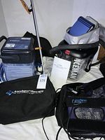 Group shot of both ice-therapy devices, Anodyne bag with contents, grabber, compression wraps