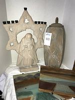 Stone Star of David menorah, urn, tiles overview