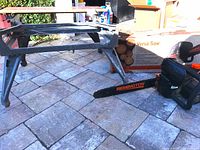 Overall view of chainsaw, work table frame and box