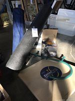 All items grouped: balance board, foam roller, yoga mat, Thera Cane, boxed exercise ball