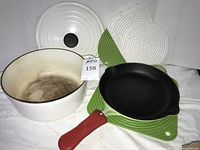 Entire lot: Dutch oven with lid, skillet, handle sleeve, silicone pads