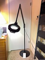 Entire lamp showing adjustable arm and magnifier head