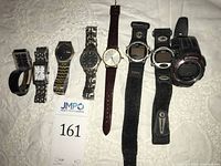 Group image of all eight watches laid out