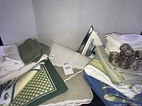 Overview of iron, folded linens, napkin rings