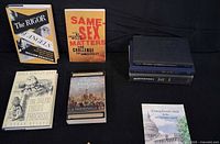 Front view of standing and laid-out books