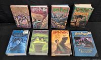 All eight hardcover Harry Potter books with dust jackets and Hogwarts Journal