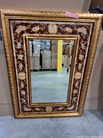 Full view of rectangular floral gold frame mirror