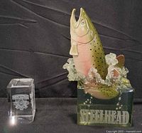 Both items: steelhead sculpture and crystal cube