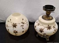 Side view of upper and lower globes showing floral metal appliqués