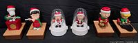 Front view of six Peanuts Christmas musician figurines