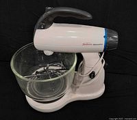 Front-left view of Sunbeam Mixmaster stand mixer with glass bowl and beaters in place