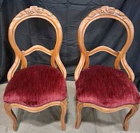 Full view of both matching carved balloon back chairs