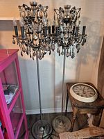 Full view of both Restoration Hardware crystal floor lamps showing overall design and height