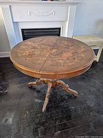 Full view of round burr walnut table top showing grain and seam