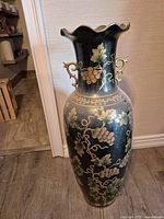 full view of black ceramic floor vase front