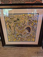 Full view of framed painting including frame and mat