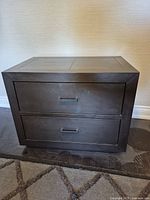 Front view of nightstand showing two drawers and pulls