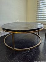 Full view of coffee table showing marble top and metal base