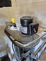 Oblique view of Craftsman dust collection blower on stand with switch box and accessories