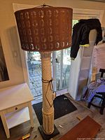 Full view of floor lamp showing column base, shade, and overall height