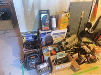 Overall lot showing turbo housing, engine cover, booster pack, boxed Blaupunkt radio and assorted accessories