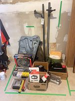 Full group view showing roof racks, door panel, boxed items and bucket