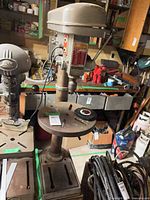 Full view of ITC floor drill press showing head, table, and base