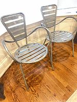 Two matching galvanized steel Gazelle armchairs