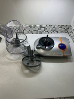 Full food processor with base, bowl, lid, disc displayed