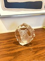 Front view of clear crystal sculpture with frosted panther carving