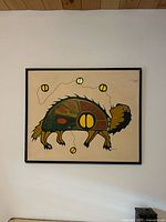 Full view of framed painting on wall