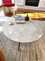 Top view showing marble surface and overall round shape