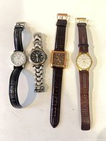 All four watches side by side showing overall condition and styles