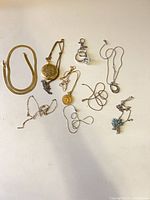 All eight jewellery pieces laid out