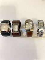 All four wristwatches side by side