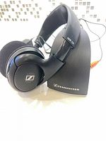 Front view HDR 125 headphones resting on TR 125 dock