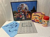 All five items: framed print, lunchbox, thermos, two guide booklets